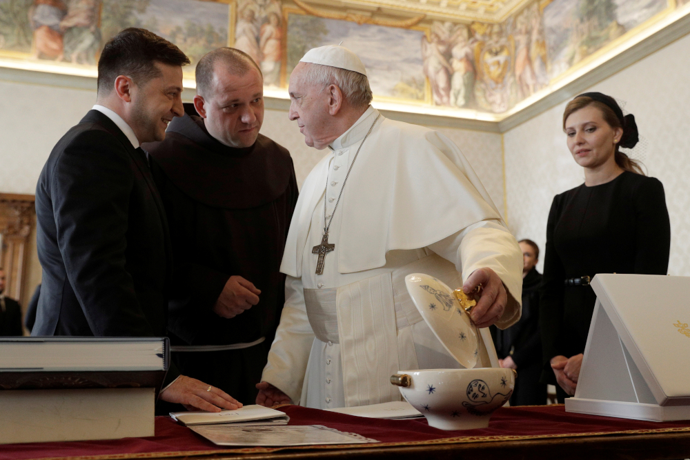 Pope Francis exchanges gifts with Ukrainian President Volodymyr Zelensky during a private audience at the Vatican in February 2020. (CNS photo/Gregorio Borgia, pool via Reuters) 