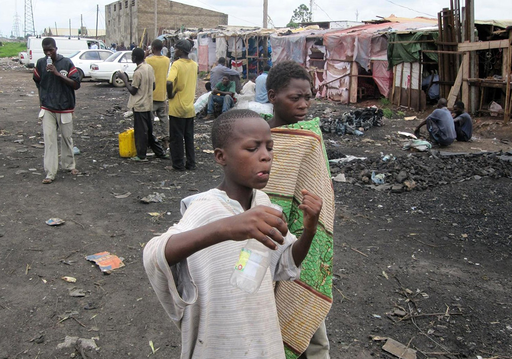 Children roam a street in Lusaka, Zambia, in this undated photo. Countries such as Zambia that are struggling with their sovereign debt would benefit from a new bill in New York that would require vulture funds to play by the same rules as other creditors. (CNS/The Catholic Spirit/Carol McBrady)