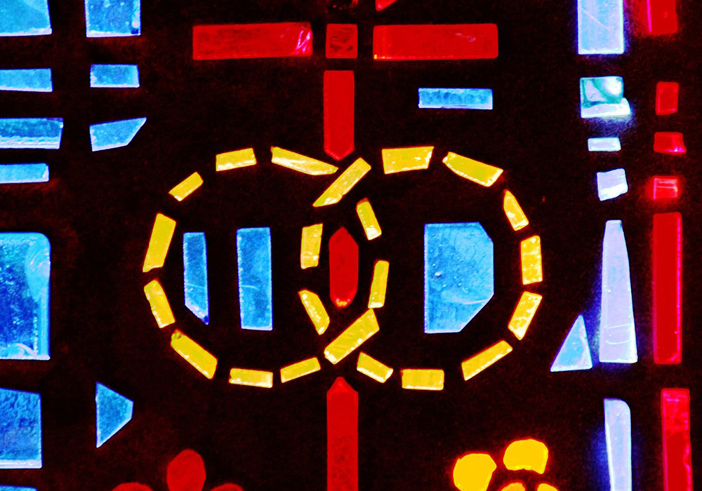 A pair of wedding bands symbolizing the sacrament of marriage is depicted in a stained-glass window at St. Isabel Church in Sanibel, Florida. (OSV News/CNS filer, Gregory A. Shemitz)