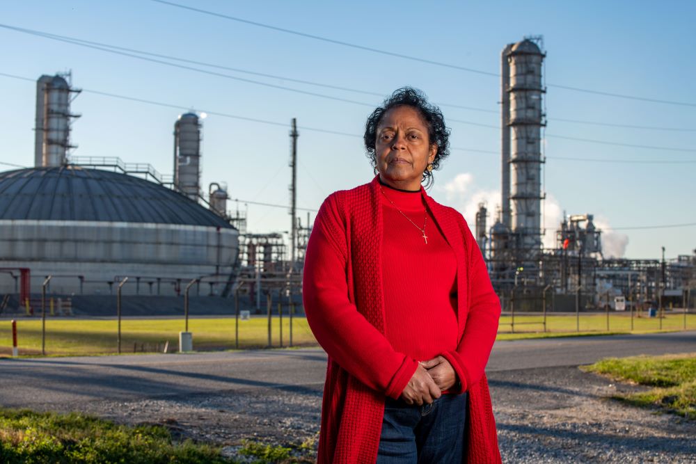 Sharon Lavigne, an environmental justice activist and founder of Rise St. James, stands in front of a chemical plant near her home in St. James Civil Parish, La., March 13, 2022.