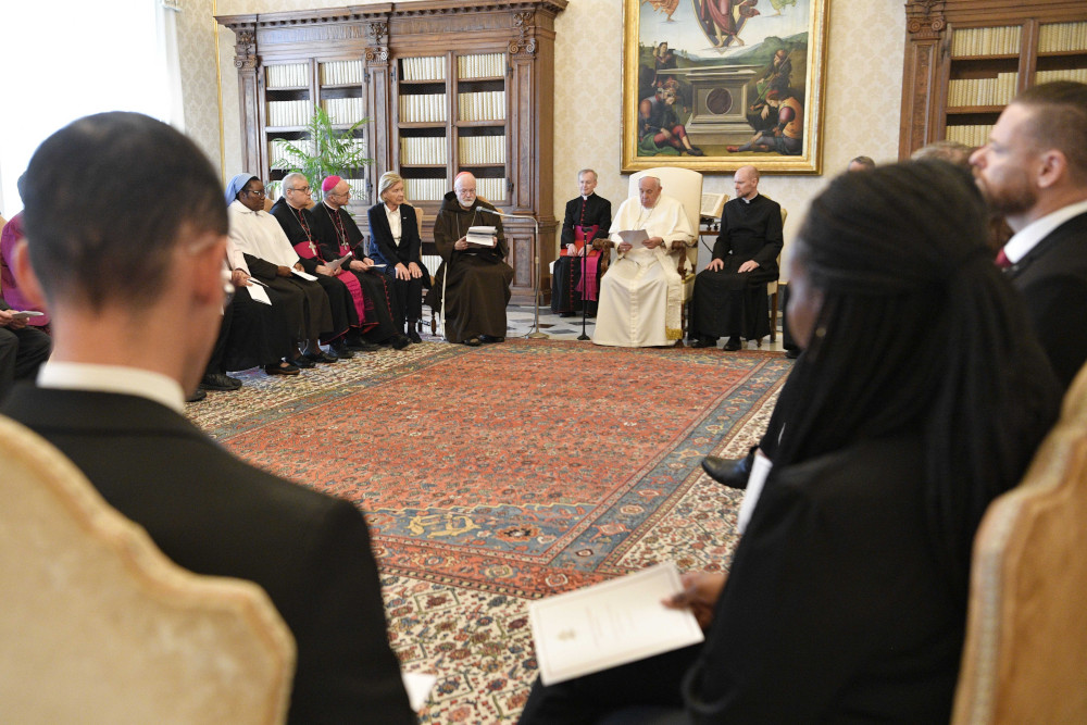 Cardinal Seán O'Malley of Boston, president of the Pontifical Commission for the Protection of Minors, speaks to Pope Francis during an audience with commission members at the Vatican May 5, 2023. (CNS photo/Vatican Media)