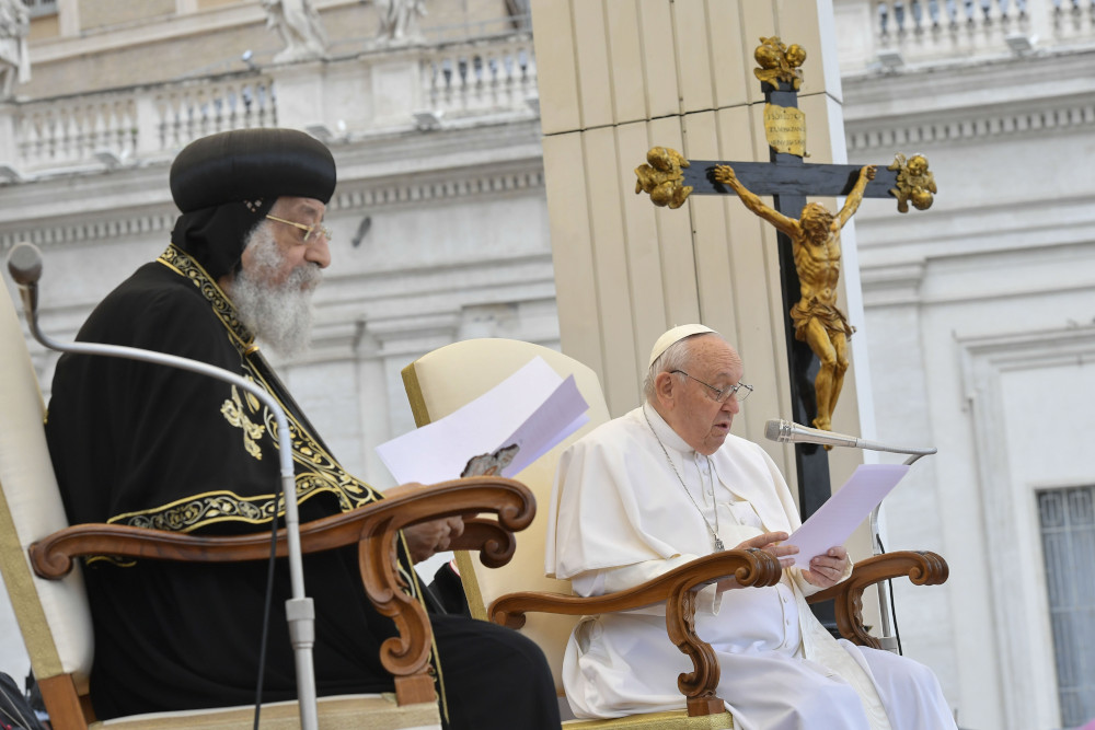 Pope Francis and Coptic Orthodox Pope Tawadros II read speeches in St. Peter's Square at the Vatican May 10, 2023. (CNS photo/Vatican Media)