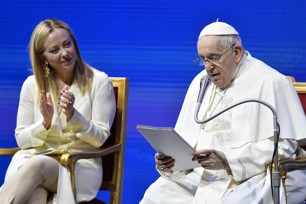 Italian Prime Minister Giorgia Meloni applauds Pope Francis during a meeting about families and Italy's declining birthrate May 12, 2023, in Rome. (CNS photo/Vatican Media)
