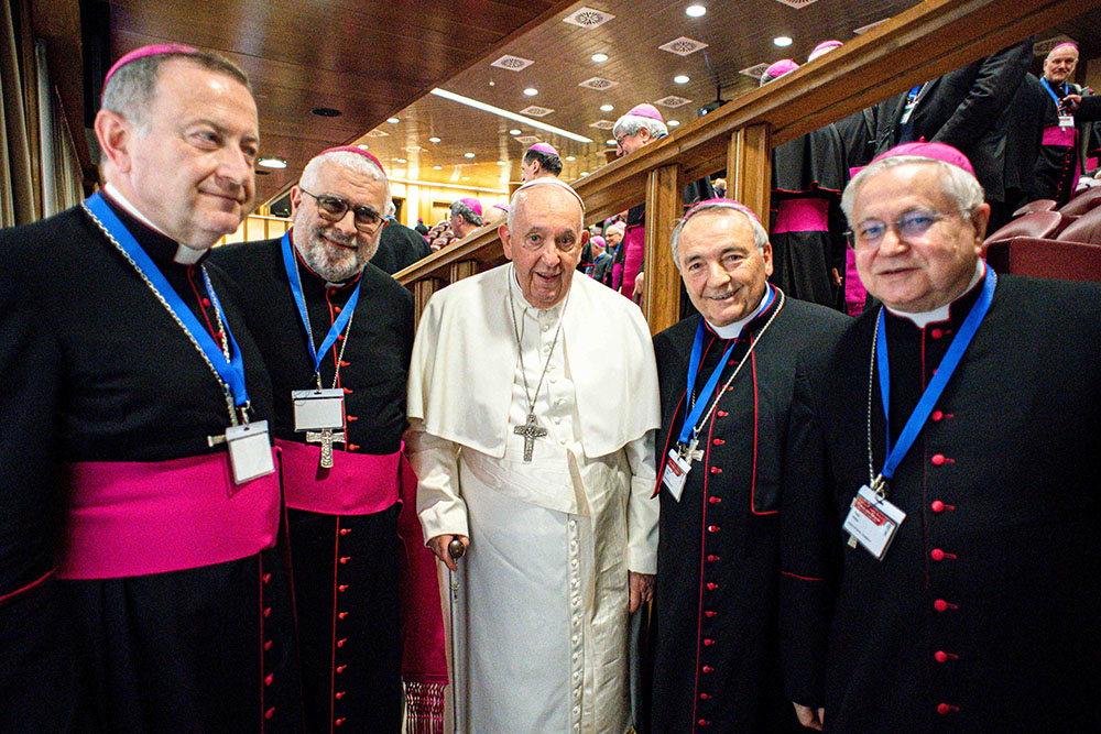 Pope Francis poses for a photo with bishops from the flooded areas of Emilia-Romagna, Italy, during the general assembly of the Italian bishops' conference at the Vatican May 22. From left are: Archbishop Lorenzo Ghizzoni of Ravenna-Cervia, Bishop Giovanni Mosciatti of Imola, Bishop Livio Corazza of Forlì-Bertinoro and Bishop Mario Toso of Faenza-Modigliana. (CNS/Vatican Media)