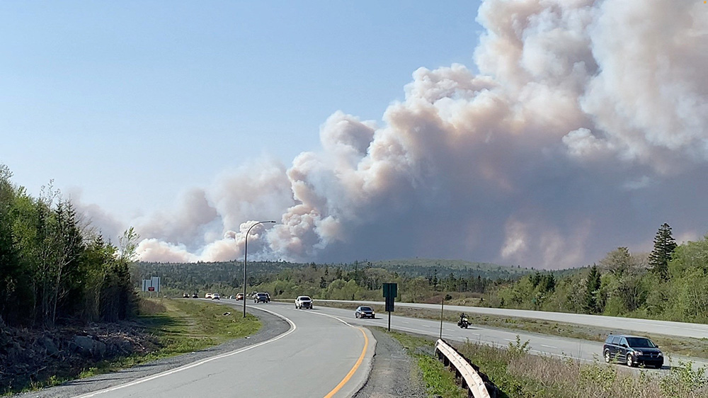 Large plumes of smoke rise from a wildfire raging in the Upper Tantallon area, as seen from Hubley, Nova Scotia, May 28 in this screen grab obtained from a social media video. (OSV News/Ben Britton via Reuters)