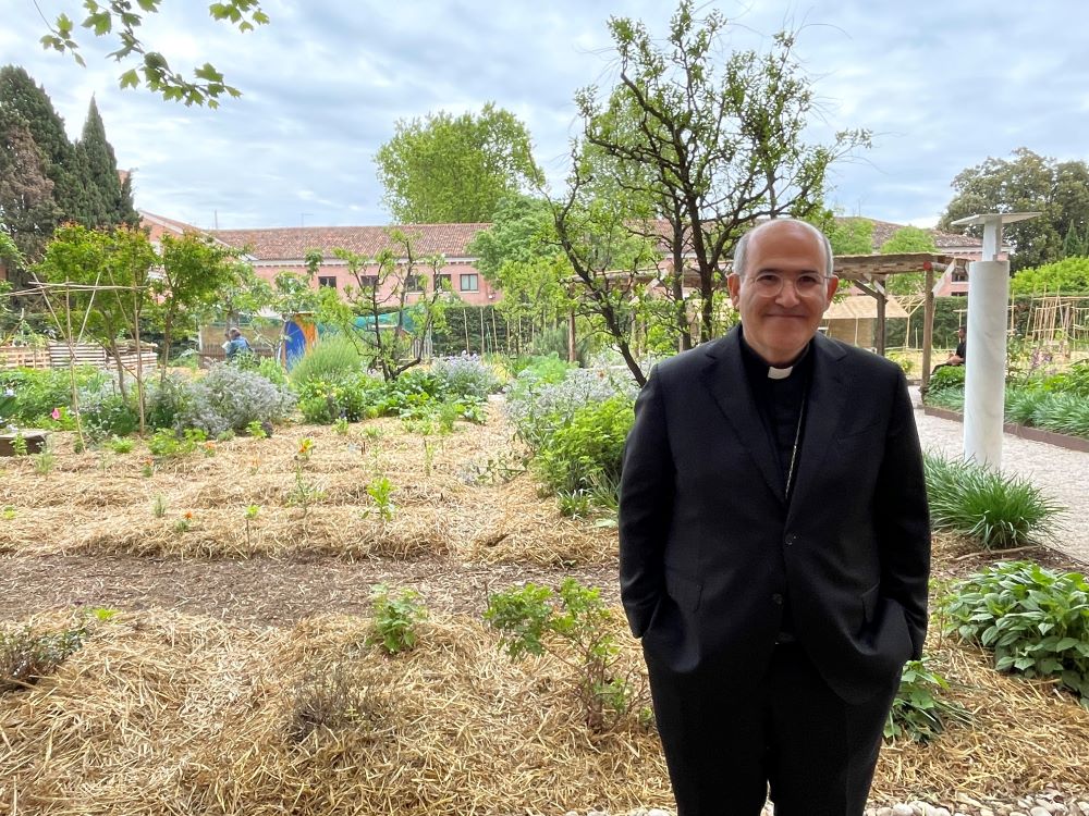 Portuguese Cardinal José Tolentino Calaça de Mendonça, head of the Vatican's Dicastery for Culture and Education, stands in the garden at the Vatican's exhibition at the Venice Biennale of Architecture. (EarthBeat photo/Christopher White)