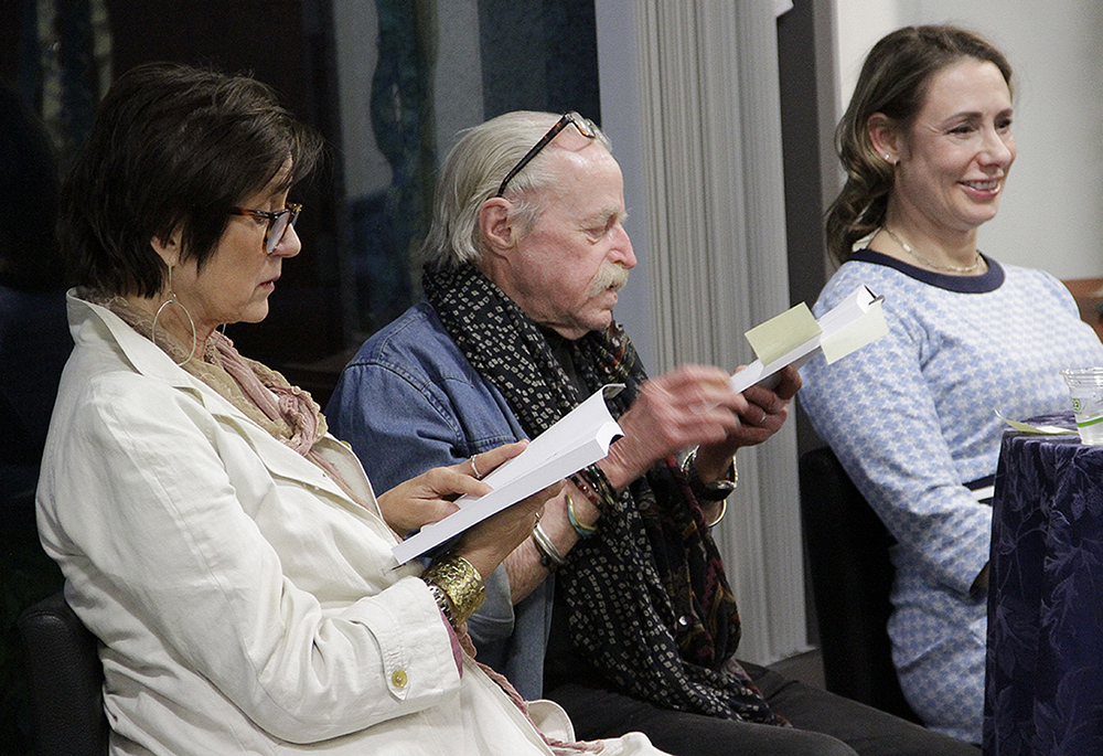 Jeff Dietrich, at center, speaks at a recent Loyola Marymount University reception to mark the release of the 40th-anniversary update of his 1983 book, Reluctant Resister. To the right is Charlotte Radler, a professor of theological studies at Loyola Marymount; to the left is Theresia de Vroom, a professor of English at Loyola Marymount. (Courtesy of Los Angeles Catholic Worker)