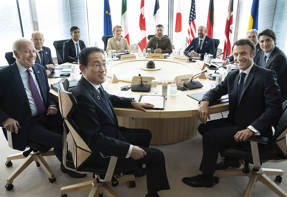 G7 world leaders attend a working session on the final day of the G7 Summit, May 21 in Hiroshima, Japan. From left: Japan's Prime Minister Fumio Kishida, U.S. President Joe Biden, German Chancellor Olaf Scholz, Britain's Prime Minister Rishi Sunak, European Commission President Ursula von der Leyen, Ukrainian President Volodymyr Zelenskyy, European Council President Charles Michel, Gianluigi Benedetti, Italian ambassador to Japan, Canada's Prime Minister Justin Trudeau, and French President Emmanuel Macron.