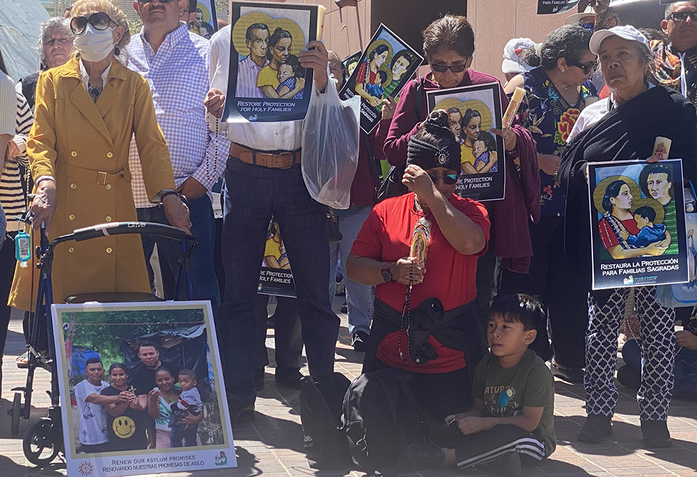 Members of Our Lady of Guadalupe parish gathered to pray for better asylum laws May 7 outside of a federal building in downtown San Diego that houses U.S. Immigration and Customs Enforcement. The church's pastor, Jesuit Fr. Scott Santarosa, led the group there after noon Mass, where parishioners prayed for those killed and injured when a car ran into a crowd outside a migrant center in Brownsville, Texas. (NCR photo/Rhina Guidos)