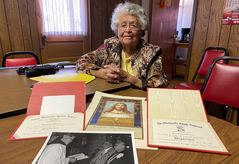 Irma Bluehouse, the granddaughter of Henry Chee Dodge and daughter of Annie Dodge Wauneka, both legendary leaders of the Navajo Nation, poses with personal memorabilia that connects her to the historic St. Michael's Mission. (Elizabeth Hardin-Burrola)