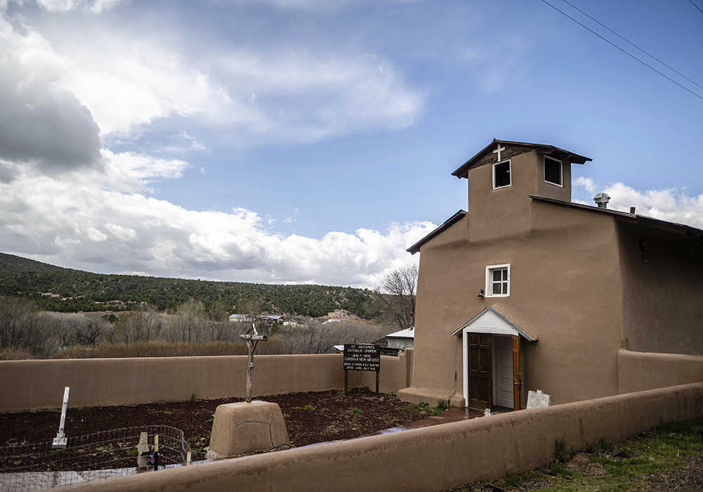 An exterior view of St. Anthony's Catholic Church, April 14 in Cordova, New Mexico. Ever since missionaries started building churches out of mud 400 years ago in what was the isolated frontier of the Spanish empire, tiny mountain communities like Cordova relied on their own resources to keep the faith going. (AP photo/Roberto E. Rosales)