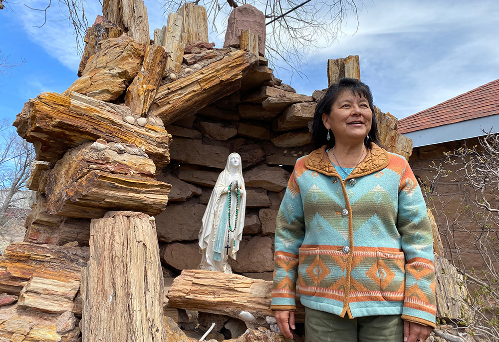 Roberta Duncan, stands in front of a shrine to the Blessed Virgin Mary on the grounds of the historic St. Michael's Mission, just west of the Navajo capital of Window Rock, Arizona. (Elizabeth Hardin-Burrola)