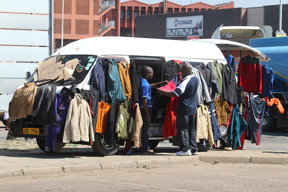 A man sells clothes from a van on the streets of Harare, Zimbabwe, May, 1, 2016. (AP/Tsvangirayi Mukwazhi)