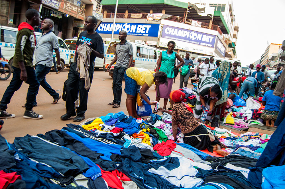 People sell secondhand clothing on Luwum Street in Kampala, Uganda. (Dreamstime/Tcockrem7)