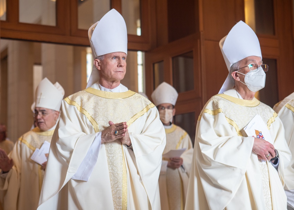 Bishop Joseph E. Strickland of Tyler, Texas, left, and second from left, and Bishop Mark J. Seitz of El Paso, Texas, process out of the Co-Cathedral of the Sacred Heart in Houston Dec. 31, 2021, following the funeral Mass of Galveston-Houston Auxiliary Bishop George A. Sheltz.