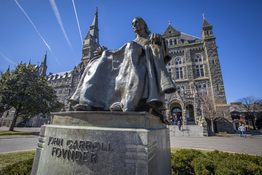 A statue of Baltimore Archbishop John Carroll — founder of Georgetown University — is seen on the Jesuit-run school's Washington campus March 3, 2022. (CNS/Chaz Muth)