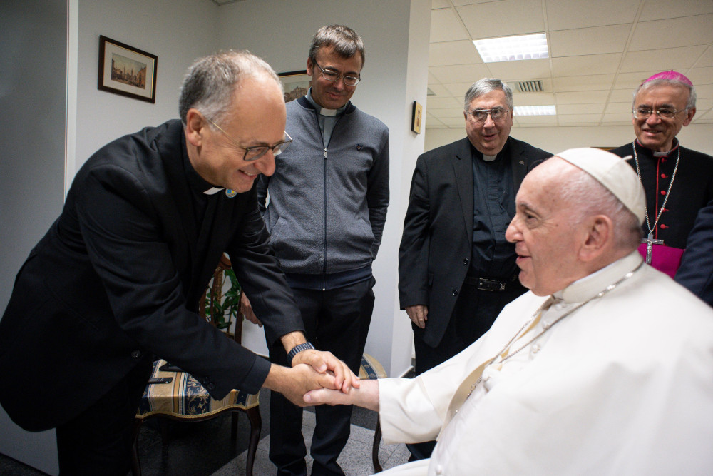 Jesuit Fr. Antonio Spadaro, director of the Jesuit journal La Civiltà Cattolica, greets Pope Francis during a meeting with Jesuits Sept. 15, 2022, at the apostolic nunciature in Nur-Sultan, Kazakhstan. The journal published a transcript of the pope's remarks to them Sept. 28, 2022. (CNS/Vatican Media)