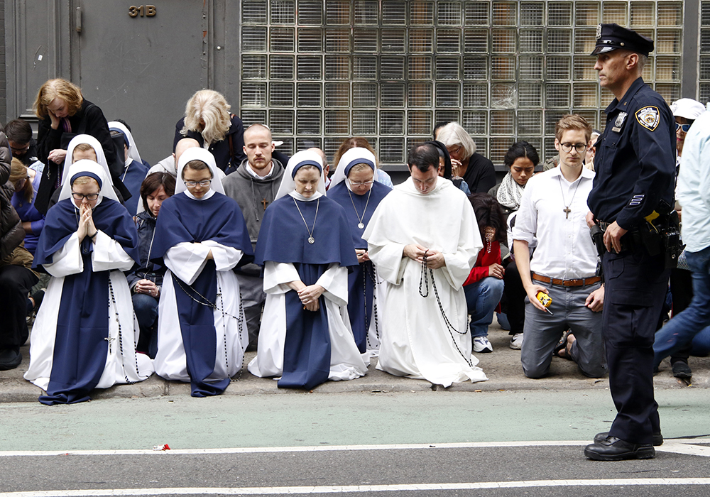 Pro-life advocates recite the rosary during a monthly "Witness for Life" prayer vigil held across the street from a Planned Parenthood center Oct. 6, 2018, in New York City. (CNS/Gregory A. Shemitz)