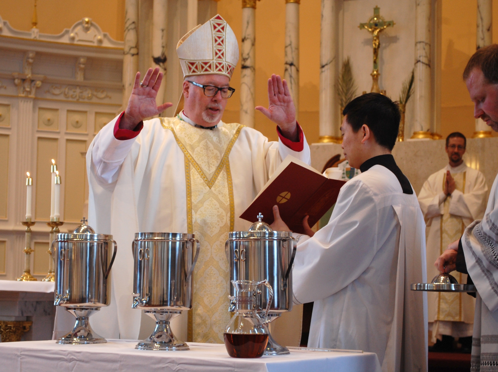 Bishop Christopher Coyne of Burlington, Vt., blesses holy oil during the chrism Mass at St. Joseph Cathedral April 16, 2019. (CNS photo/Cori Fugere Urban, Vermont Catholic) 