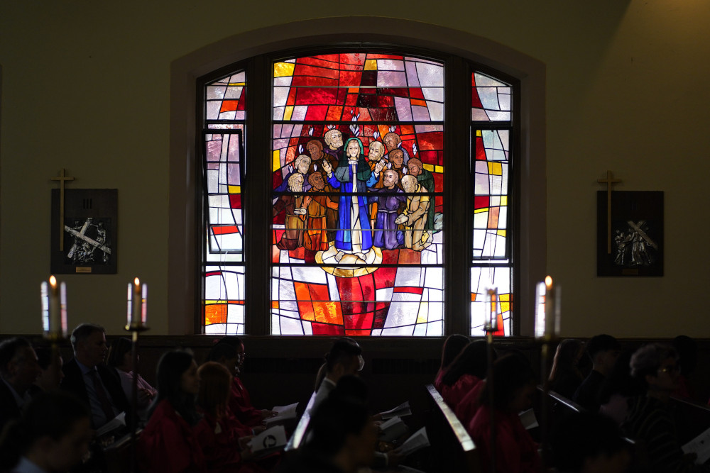 A stained-glass window depicting the descent of the Holy Spirit upon Mary and the apostles is seen during a confirmation Mass May 5, 2022, at Holy Family Church in Queens, N.Y. (CNS photo/Gregory A. Shemitz)