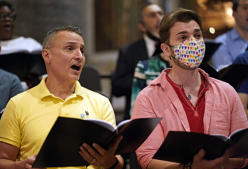 Choir members sing during a Mass at St. Paul the Apostle Church June 25, 2022, in New York City, for participants of the Outreach LGBTQ Catholic Ministry Conference. The event, held at the church and at the Lincoln Center campus of Fordham University June 24 and 25, drew 250 registrants from across the U.S. and from Colombia, Italy, Spain and Uganda. (CNS/Gregory A. Shemitz)