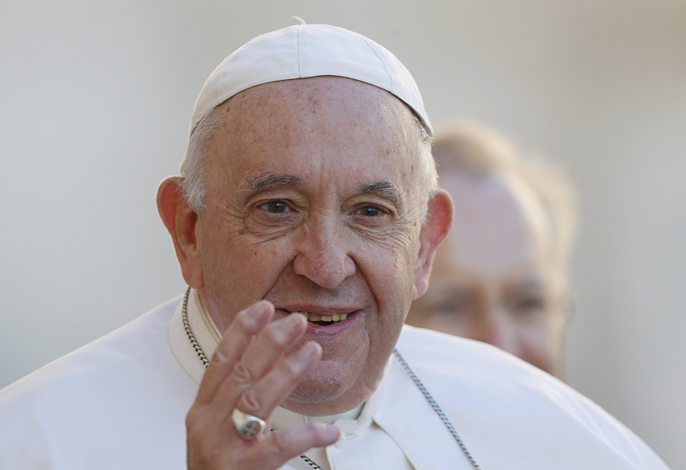  Pope Francis greets the crowd as he arrives for his general audience in St. Peter's Square Oct. 5, 2022, at the Vatican. (CNS/Paul Haring)