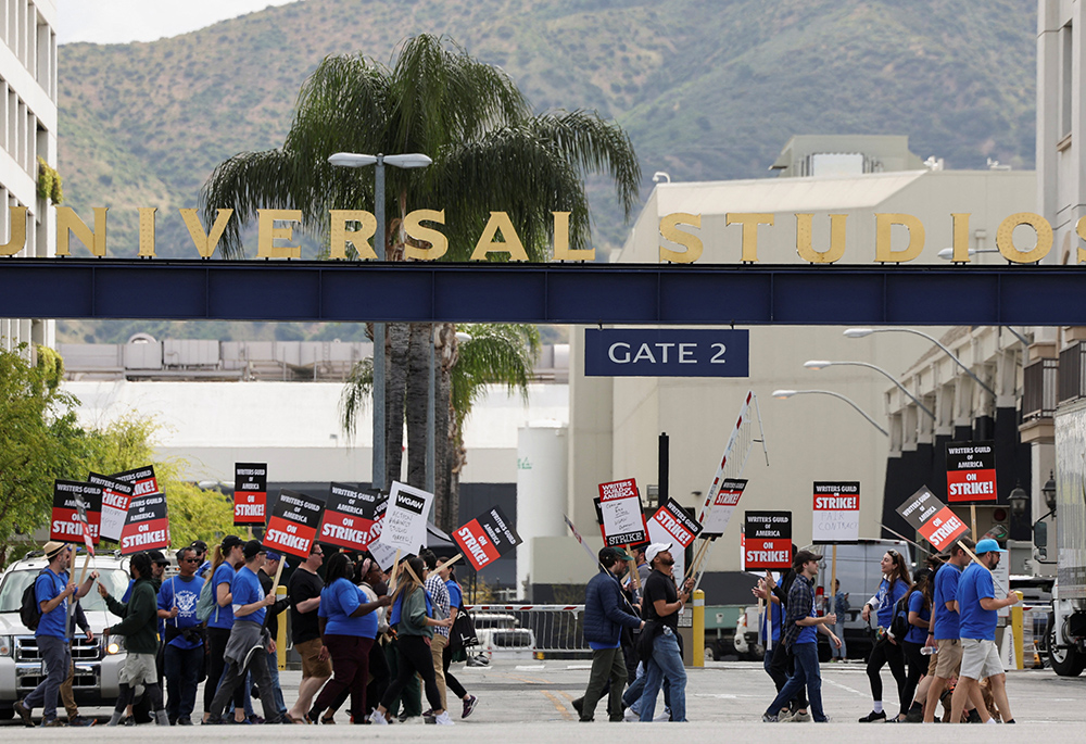 Workers and supporters of the Writers Guild of America protest outside Universal Studios Hollywood May 3, in the Universal City area of Los Angeles a day after union negotiators called a strike for film and television writers. (OSV News/Reuters/Mario Anzuoni)