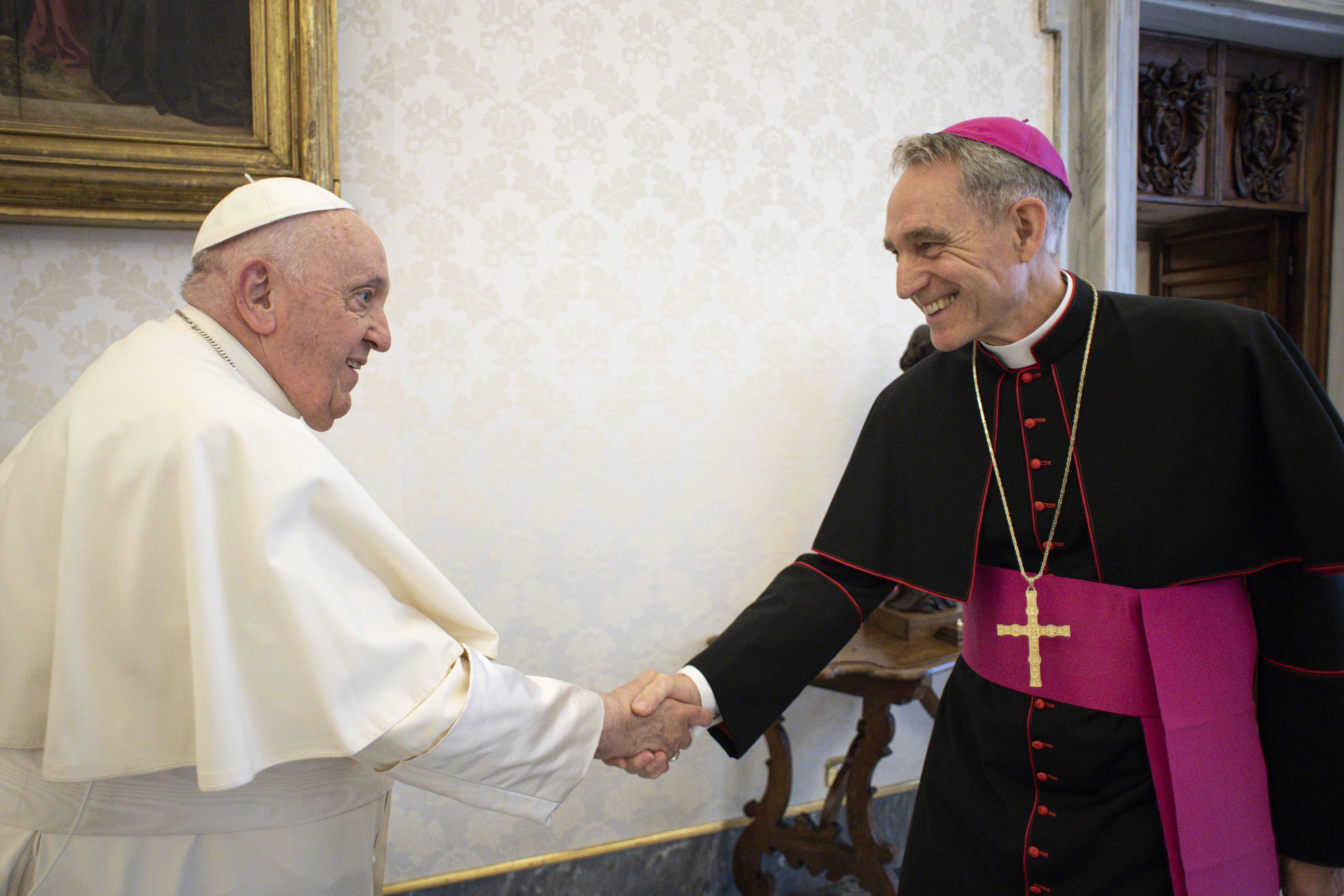 Pope Francis meets Archbishop Georg Gänswein, personal secretary to the late Pope Benedict XVI, in the library of the Apostolic Palace at the Vatican May 19, 2023. Although he still has the title of prefect of the papal household, Archbishop Gänswein has not worked in the office since 2020 and is awaiting a new assignment. (CNS photo/Vatican Media)