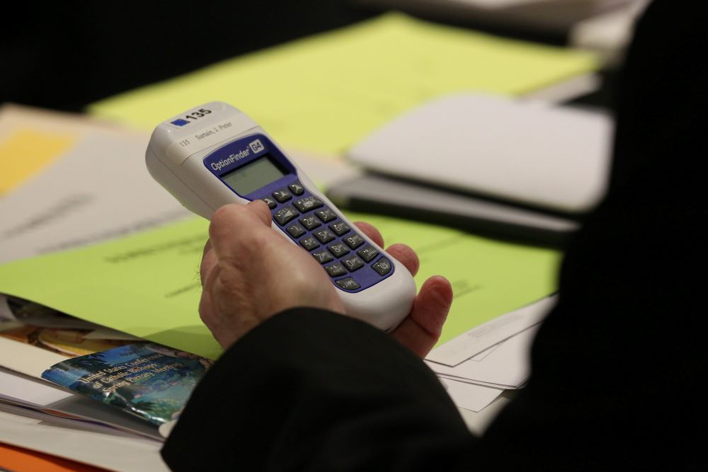 A prelate prepares to vote during the 2018 U.S. Conference of Catholic Bishops' spring assembly in Fort Lauderdale, Fla.