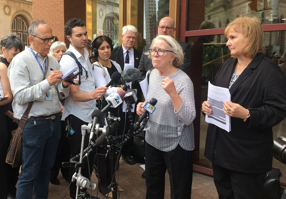 Jean Wehner, a survivor of sexual abuse in the Archdiocese of Baltimore, addresses the media outside the Maryland Attorney General's office in Baltimore April 5.