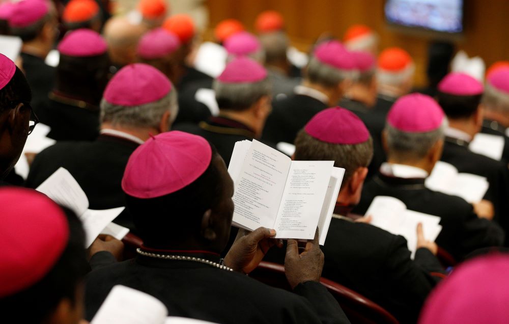 Bishops pray at the start of a session of the Synod of Bishops on Young People, Faith and Vocational Discernment at the Vatican Oct. 9, 2018. The Vatican released its working document, or "instrumentum laboris," for the upcoming world Synod of Bishops on June 20. (CNS/Paul Haring)