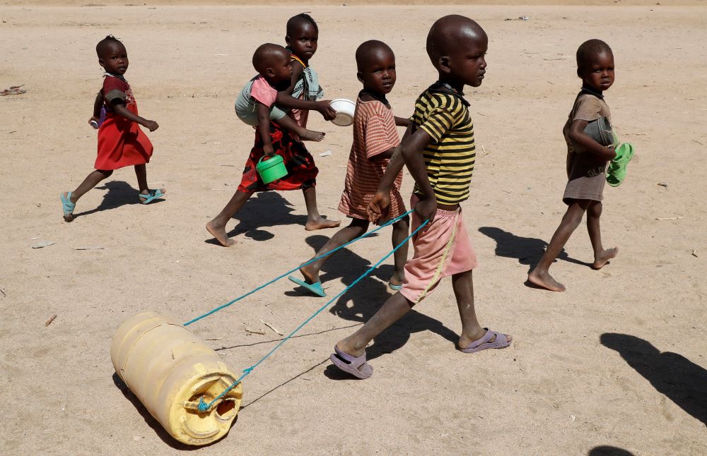A child affected by drought in Kenya pulls a jerrycan of water at Sopel village in Turkana, Kenya, Sept. 27.