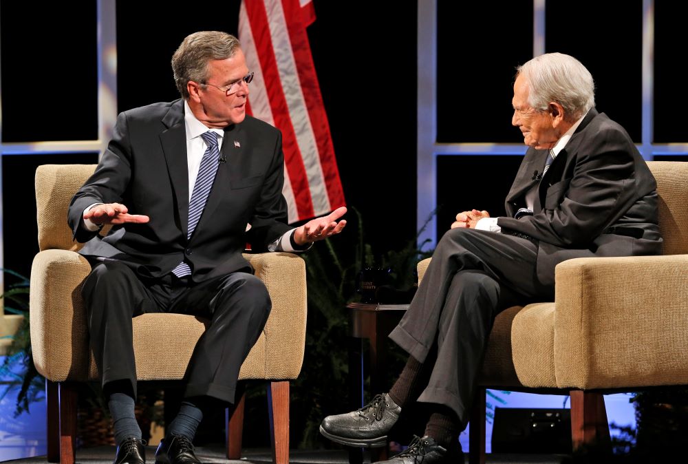 Pat Robertson, right, speaks with Republican presidential candidate Jeb Bush during a presidential candidate forum at Regent University in Virginia Beach, Va., Oct. 23, 2015. Robertson, who died June 8 at age 93, ran for the Republican nomination for president in 1988, coming in behind both George H.W. Bush and Bob Dole. (AP/Steve Helber)