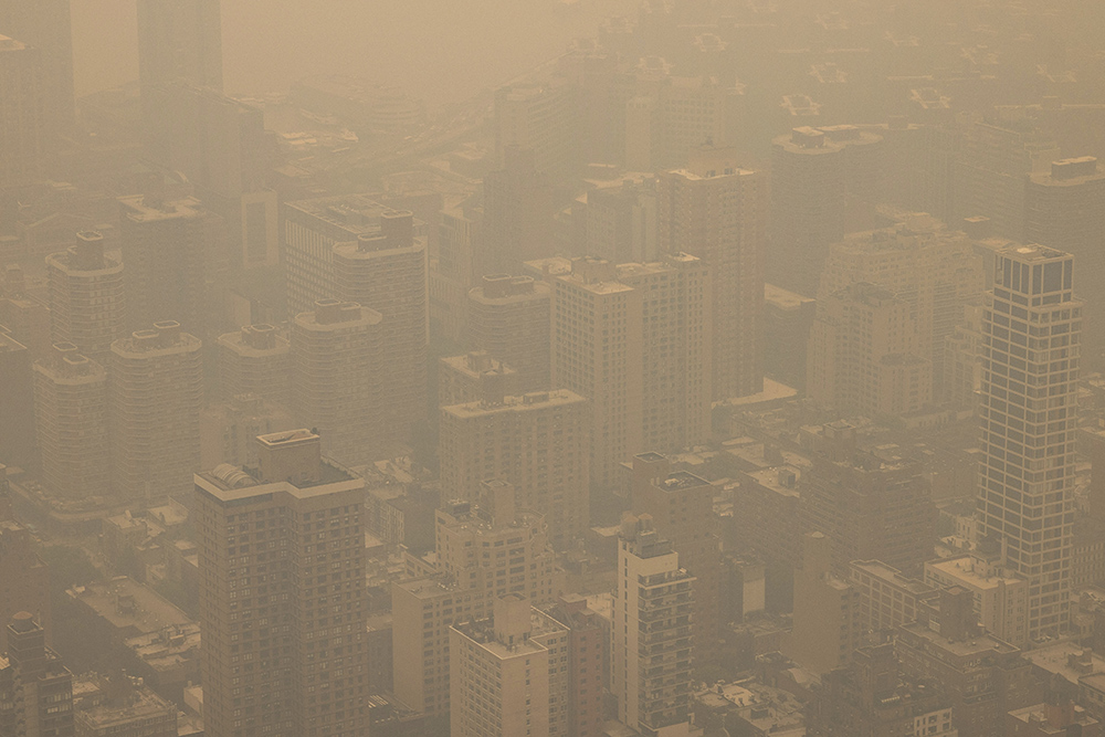 In a view from the Empire State Building observatory June 7, New York City is engulfed in a haze of thick, smoky air from Canadian wildfires. (AP/Yuki Iwamura, File)