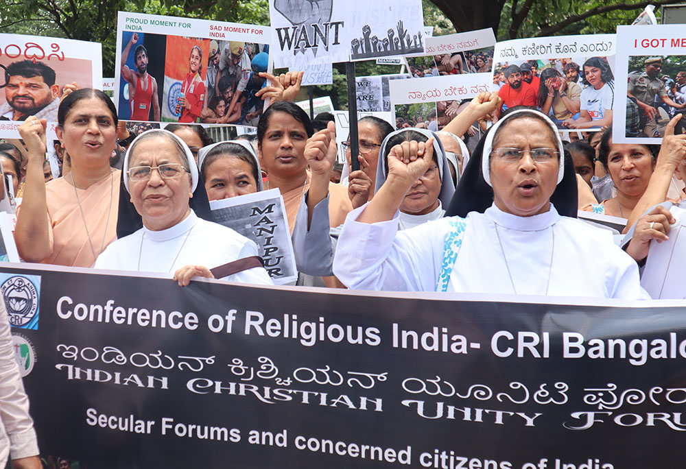 Women religious leaders shout slogans in support of striking women wrestlers and against government apathy toward violence in Manipur state, in Bengaluru, India, on June 4. (Courtesy of Sister Clarice Maria)