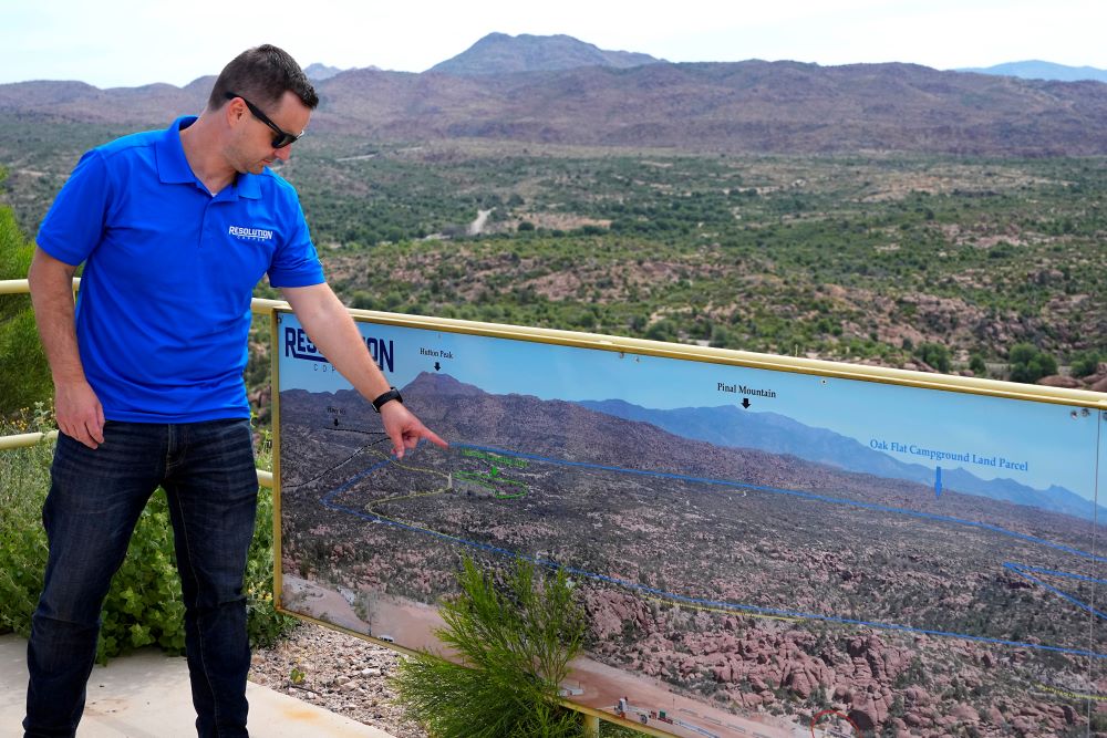 Resolution Mining Company spokesman Tyson Nansel shows the locations of the proposed new mining site and Oak Flat Campground, Friday, June 9, 2023, in Miami, Ariz. (AP Photo/Matt York)