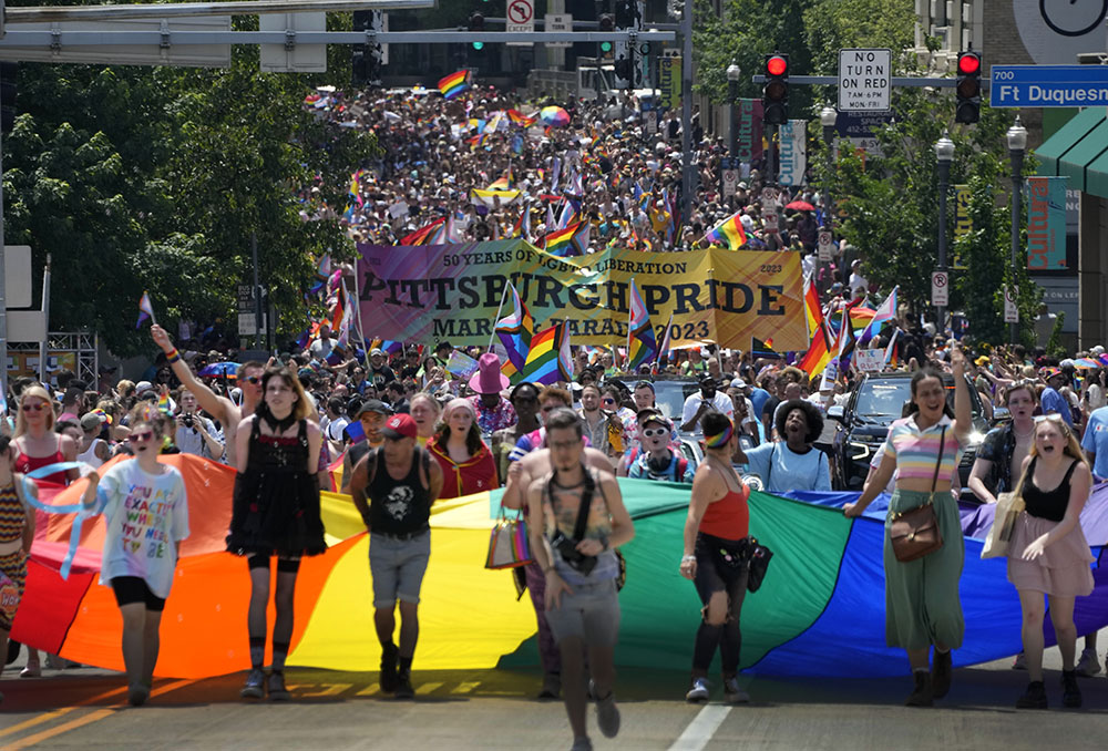The Pittsburgh Pride parade crosses the Andy Warhol Bridge from downtown Pittsburgh June 3. Bishop David Zubik canceled a planned June 11 Mass in solidarity with LGBTQ people after a flyer advertising it as a "Pride Mass" was circulated on social media and anti-LGBTQ Catholic influencers urged their followers to contact him (AP/Gene J. Puskar)