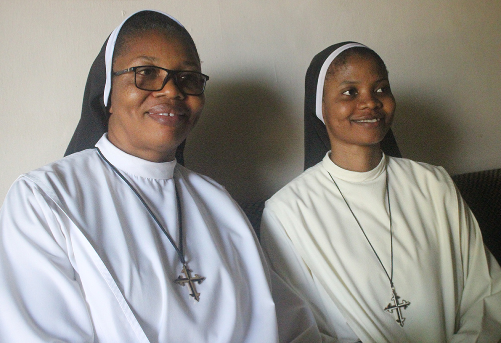 Sr. Justina Nnajiofor, left, and Sr. Chinaza Eze, members of the Dominican Sisters of St. Catherine of Siena, told Global Sisters Report that their faith is unshaken in the face of attacks by bandits in Nigeria. (Patrick Egwu)