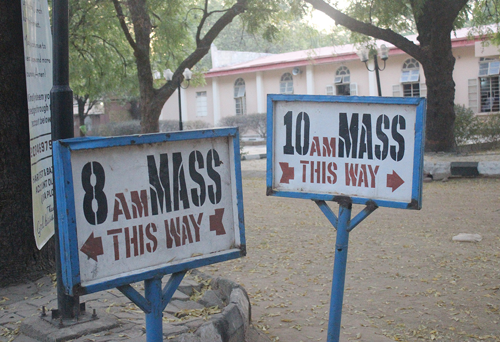 Two sign posts direct parishioners to locations for Mass inside Our Lady of Fatima Catholic Church in the city of Gusau, in Zamfara state, northwest Nigeria (Patrick Egwu)