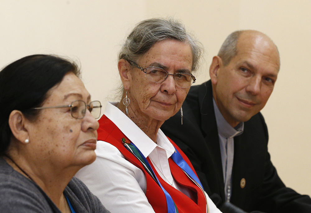 Rita Means, tribal council representative with the Rosebud Sioux Tribe, Sr. Priscilla Solomon, a member of the Ojibway people and of the Sisters of St. Joseph of Sault Ste. Marie, and Archbishop Donald Bolen of Regina, Saskatchewan, attend a news conference with Indigenous leaders from North America Oct. 17, 2019, in Rome. (CNS/Paul Haring)