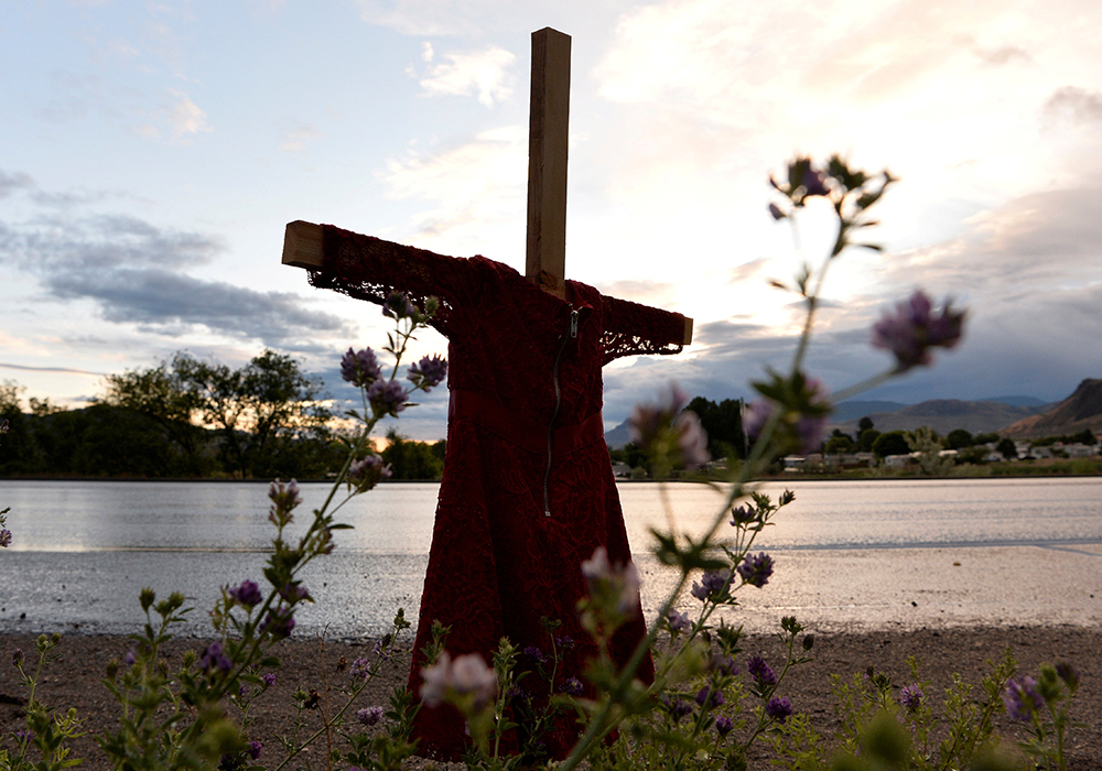A child's red dress hangs on a stake near the grounds of the former Kamloops Indian Residential School in Kamloops, British Columbia June 5, 2021. For years Indigenous people in Canada wanted an apology from the pope for the church's role in abuse at Catholic-run residential schools. Pope Francis came to Canada in July 2022 for a six-day "penitential pilgrimage" that had long been awaited by survivors. (CNS/Reuters/Jennifer Gauthier)