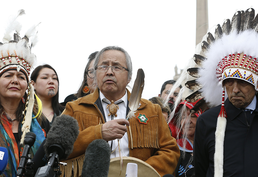 Chief Gerald Antoine, center, Northwest Territories regional chief of the Assembly of First Nations, speaks as First Nations delegates meet the media outside St. Peter's Square after a meeting with Pope Francis March 31, 2022, at the Vatican. Also pictured are Rosanne Casimir, chief of the Tk'emlúps te Secwépemc, and Phil Fontaine, former national chief of the Assembly of First Nations. (CNS/Paul Haring)