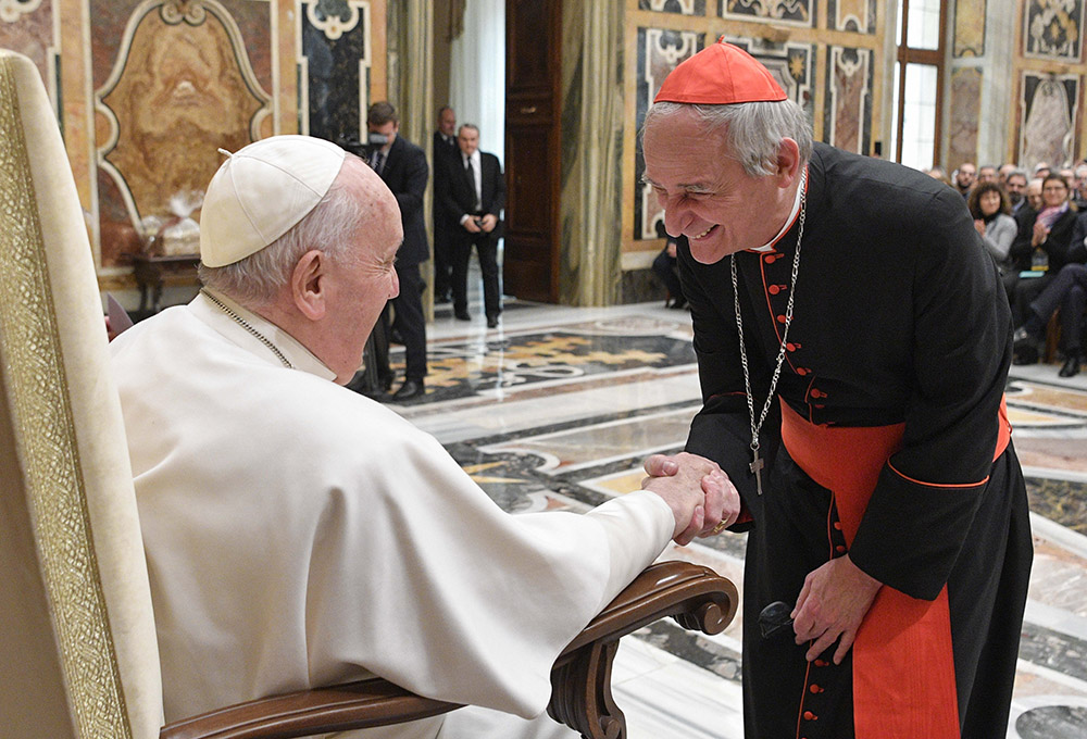 Pope Francis greets Cardinal Matteo Zuppi, president of the Italian bishops' conference, during a meeting with representatives of most of Italy's 227 dioceses in the Clementine Hall of the Apostolic Palace at the Vatican Feb. 16. (CNS/Vatican Media)