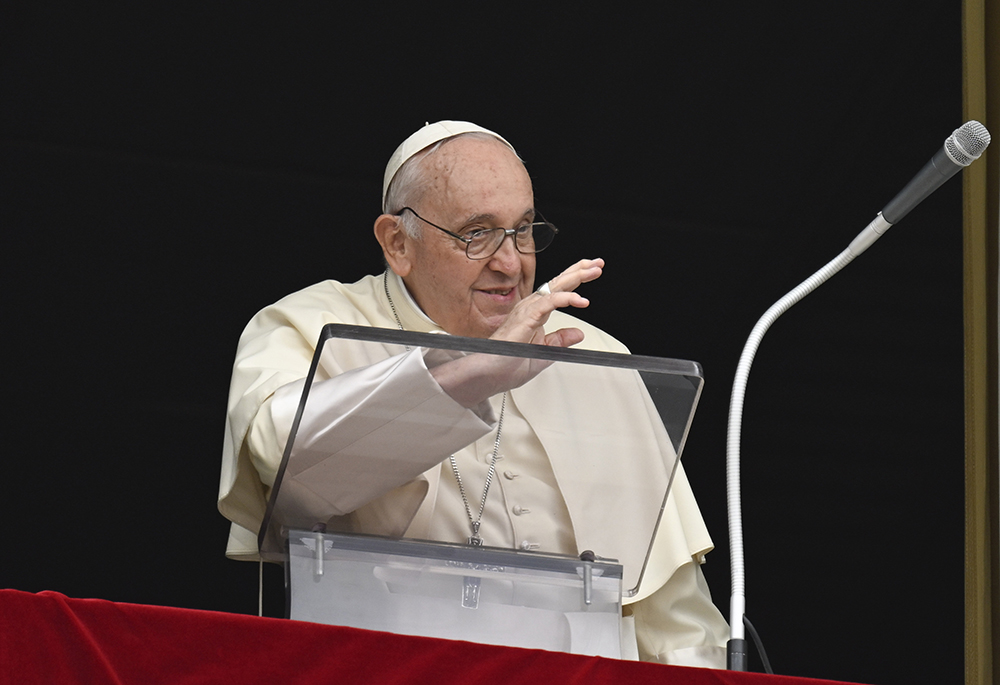 Pope Francis greets visitors in St. Peter's Square at the Vatican to pray the Angelus on June 29. (CNS/Vatican Media)