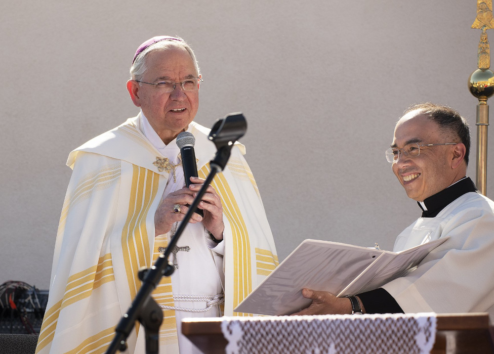 Los Angeles Archbishop José Gomez and Fr. Brian Nunes, then the archbishop's priest secretary, are pictured at the dedication of a new gymnasium at Sacred Heart High School in Northeast LA in 2019. (OSV News photo/Victor Alemán, Angelus News)