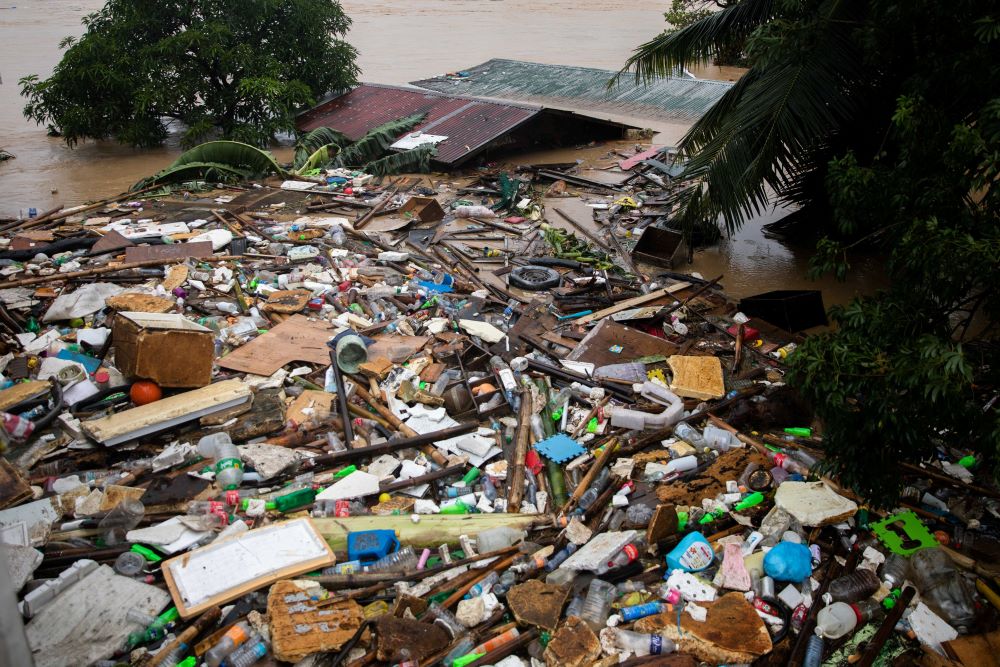 Debris is pictured amid submerged homes near Manila, Philippines, Nov. 12, 2020, following Typhoon Ulysses. Officials at the time said nearly 200,000 people had been evacuated, some forcibly, from vulnerable coastal and low-lying areas. (CNS/Reuters/Eloisa Lopez)
