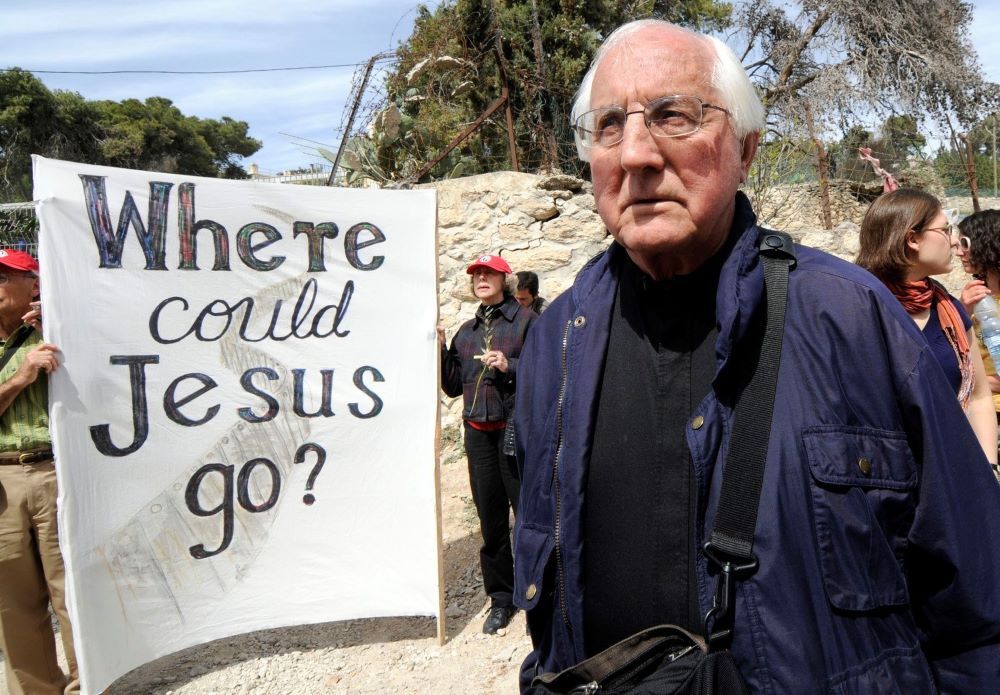 Retired Auxiliary Bishop Thomas Gumbleton of Detroit joins local Palestinians and international visitors for a Palm Sunday procession from Lazarus' tomb in Bethany to the Bethany Gate at the Israeli separation wall in the West Bank March 16, 2008. (CNS/Debbie Hill)