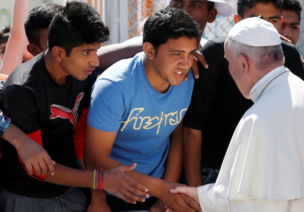 Pope Francis meets refugees at the Moria refugee camp on the island of Lesbos, Greece, in this April 16, 2016, file photo. (CNS/Paul Haring) 