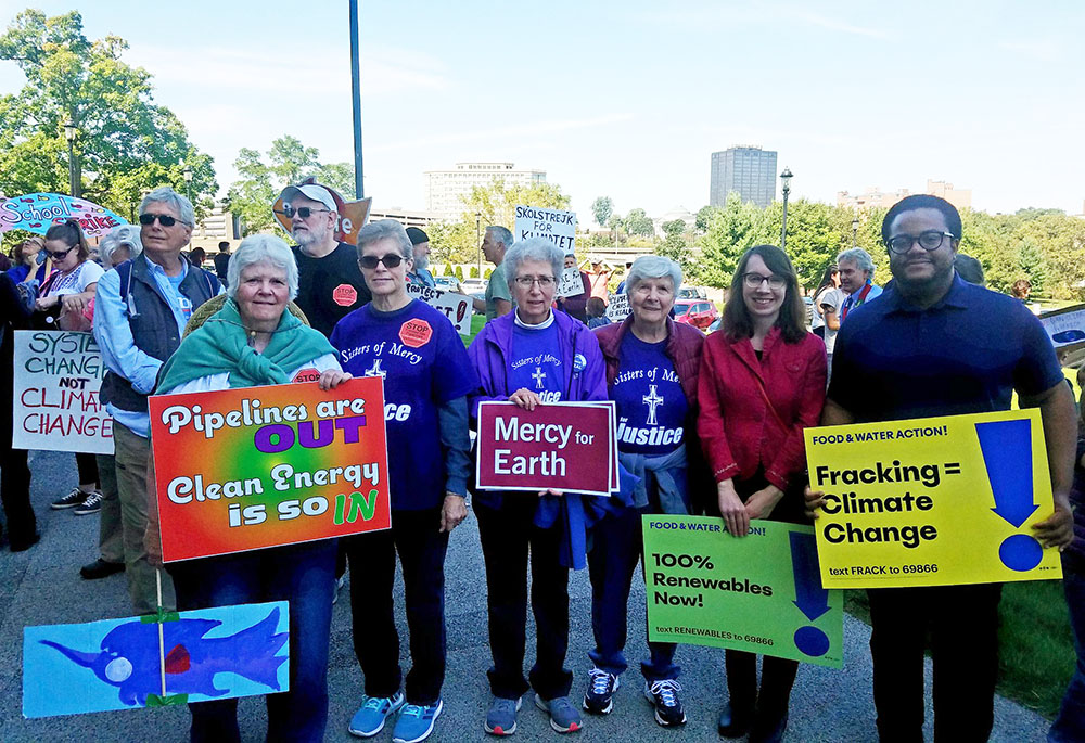 Collaborative Center for Justice staff and volunteers rally for climate justice at the Connecticut state capitol in 2019. (Courtesy of Dwayne David Paul)