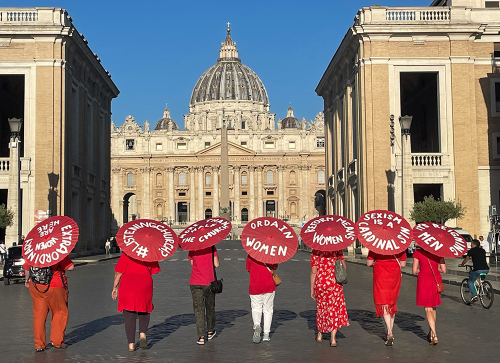 Women's ordination advocates walk toward St. Peter's Square as part of a witness on Aug. 29, 2022. (NCR photo/Christopher White)